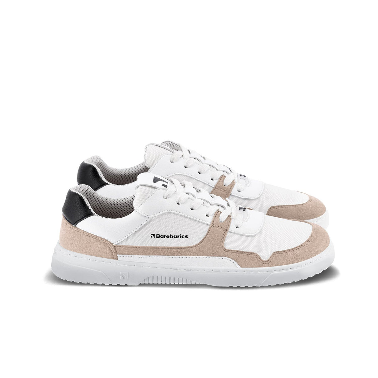 Low-top sneakers in white with beige suede accents and black heel detail, branded side logo, white laces, and textured.