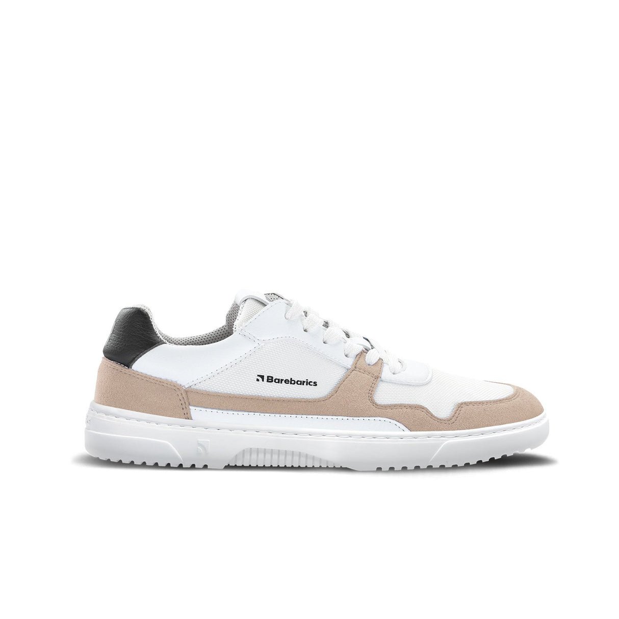 White low-top sneaker with beige suede accents, black heel tab, and textured white sole.