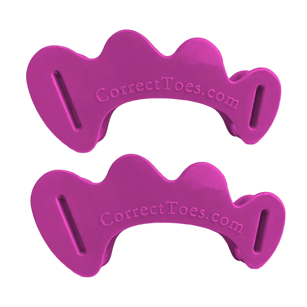 Pair of plum-colored Correct Toes original toe spacers with rounded edges and three toe slots each.