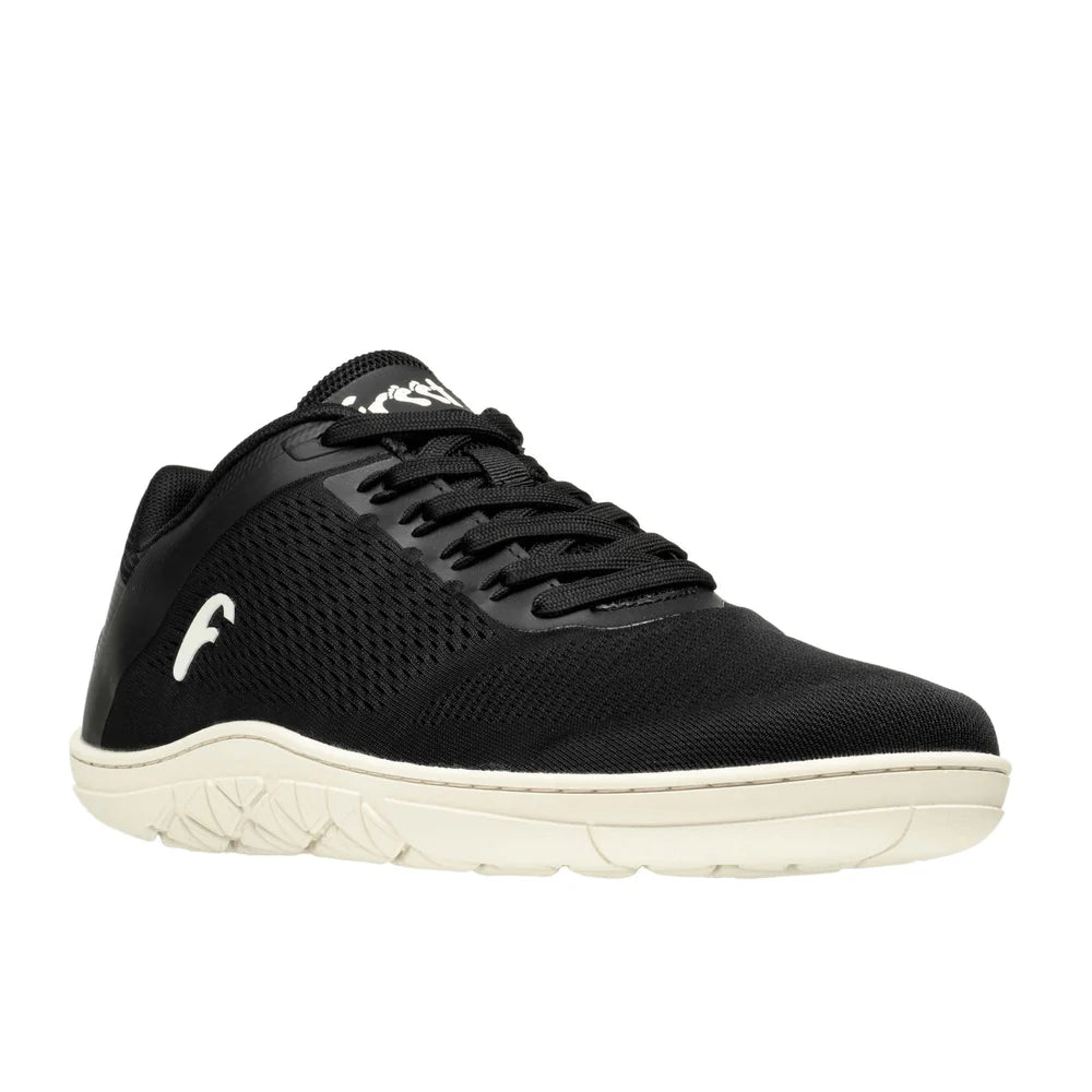 Black breathable mesh sneaker with white textured sole and logo on side and tongue.