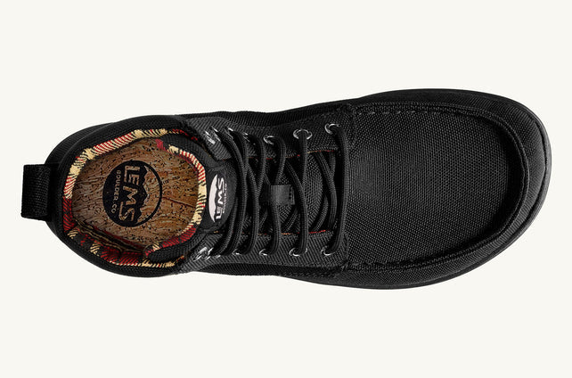 Black nylon vegan boot with lace-up front and cushioned collar, top view showing patterned insole.