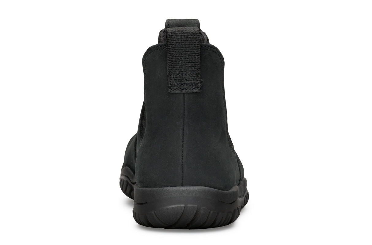 Black waterproof Chelsea boot with smooth matte finish and thick rubber sole, rear pull tab visible.