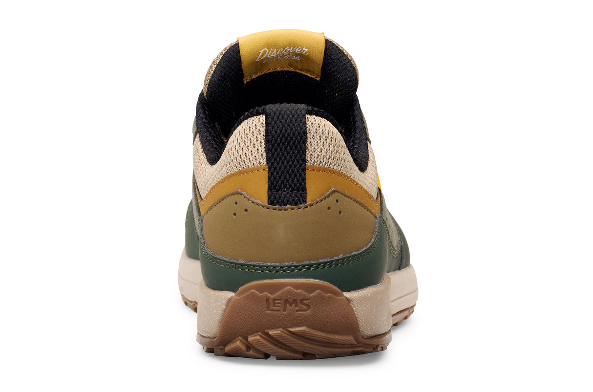 Juniper green and tan casual sneaker with black accents and thick beige sole, rear view.