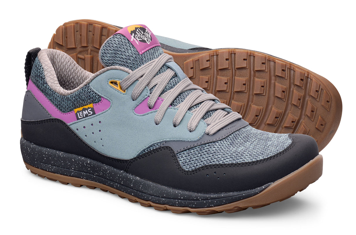 Gray and black Lems Trail Blazer sneakers with pink accents and gum soles.