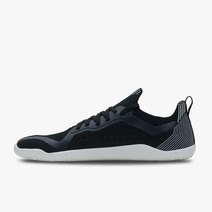 Men's sleek black knit athletic shoe with white soles and textured heel detailing.