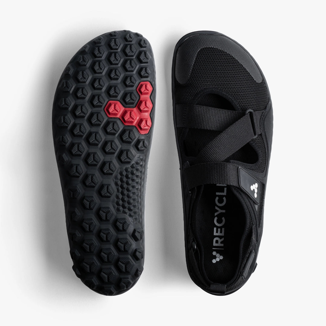 Black athletic sandal with multiple crossing straps and textured sole with red accents.