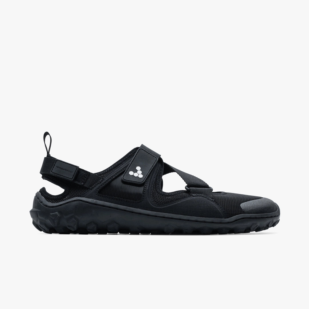 Black athletic sandal with adjustable straps, textured sole, and minimalist design.