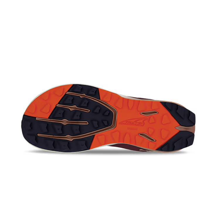 Dark purple and bright orange treaded outsole of athletic shoe with multi-directional grip patterns.