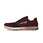 Dark purple women's trail running shoe with beige sole and orange tread, side logo visible.