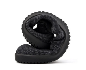 Grey recycled slip-on sneaker folded to showcase flexible, textured sole and knit upper.