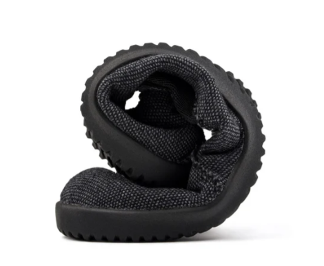 Grey recycled slip-on sneaker folded to showcase flexible, textured sole and knit upper.