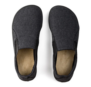 Grey slip-on sneakers with textured fabric upper and cushioned beige insoles.