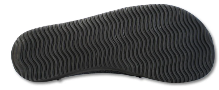 Grey slip-on sneaker with textured wavy rubber sole for traction and flexibility.