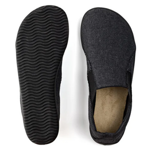 Grey slip-on sneaker with textured sole and soft inner lining.