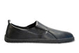 Black vegan leather slip-on sneaker with rounded toe and textured rubber sole.