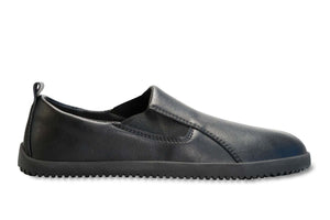 Black vegan leather slip-on sneaker with rounded toe and textured rubber sole.