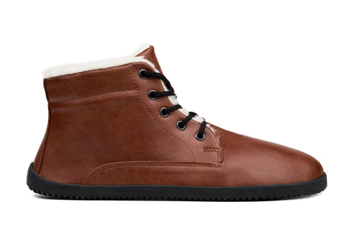 Brown leather minimalist ankle boots with black laces and thin black sole.