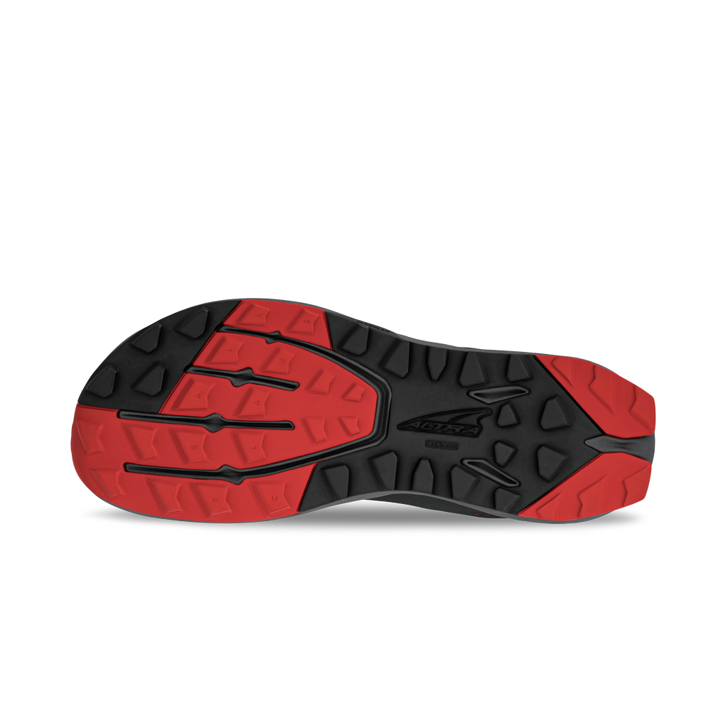 Black and red athletic shoe sole with multidirectional tread pattern and textured grip areas.