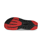 Black and red athletic shoe sole with multidirectional tread pattern and textured grip areas.