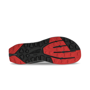 Black and red rugged outsole tread with deep grooves for traction on Altra Superior 7 shoes.