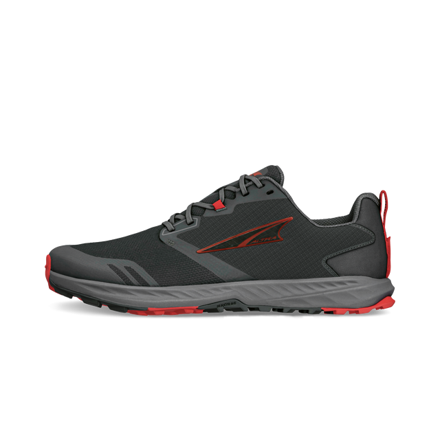 Black and gray athletic running shoe with red accents and cushioned sole.