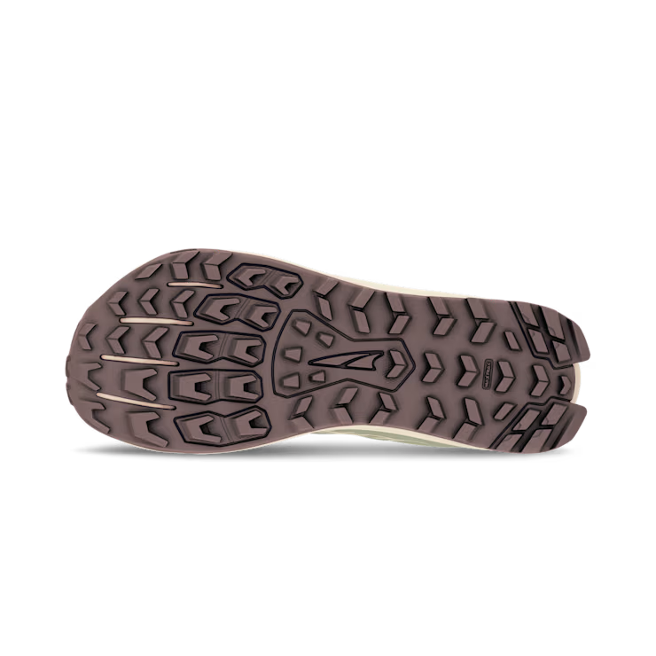 Brown rugged sole of a trail running shoe with deep multi-directional lugs for traction.