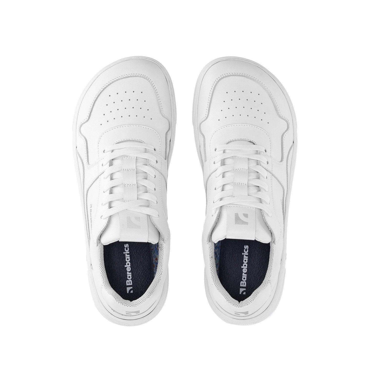 All-white leather sneakers with perforated toe box and lace-up closure.