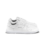 All-white leather low-top sneakers with textured sole and perforated toe detail.