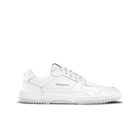 All-white low-top leather sneaker with textured sole and subtle logo on side.