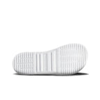 White rubber shoe sole with horizontal and vertical grooves for traction.