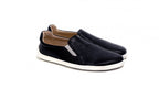 Black slip-on casual shoes with white soles and tan interior lining.