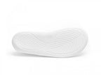 White rubber sole with curved leaf-like textured patterns for grip.