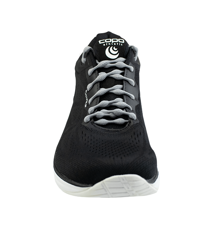 Black athletic shoe with gray no-tie Caterpy shoelaces threaded through eyelets.