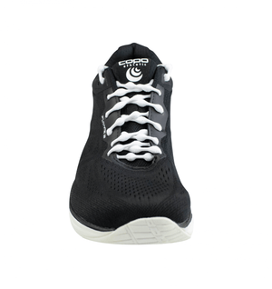 Black sneaker with white no-tie shoelaces threaded in a looped pattern.