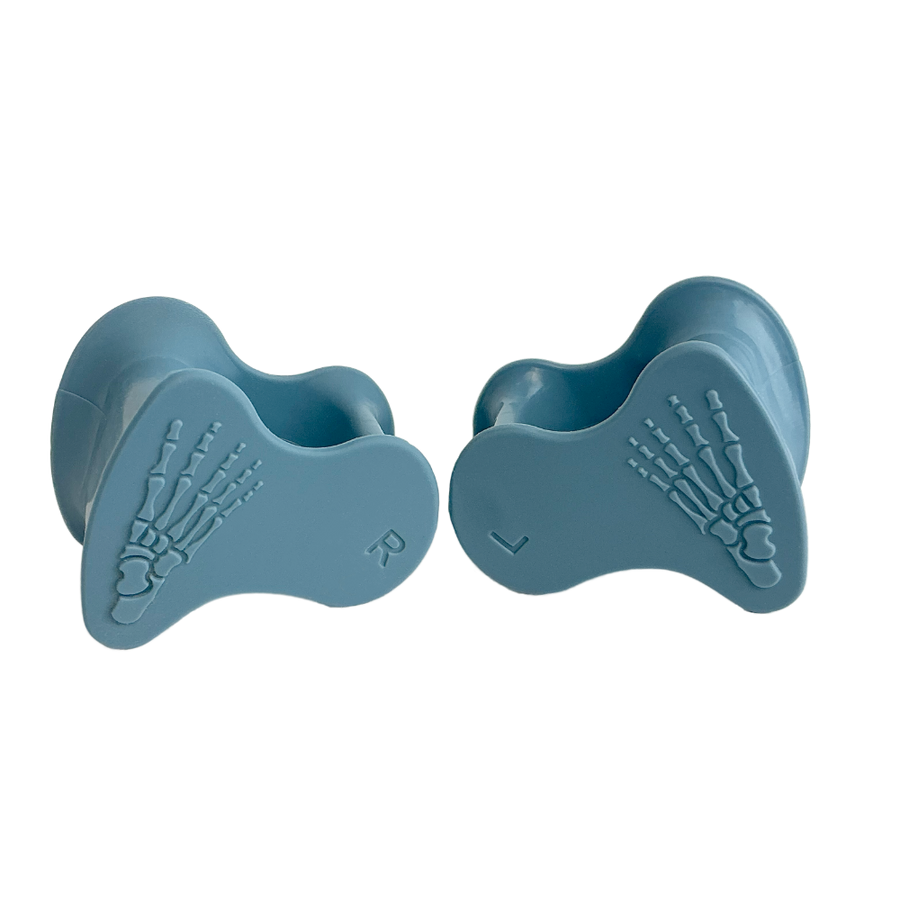 Blue silicone toe spacers with skeletal foot bone design, labeled L and R.