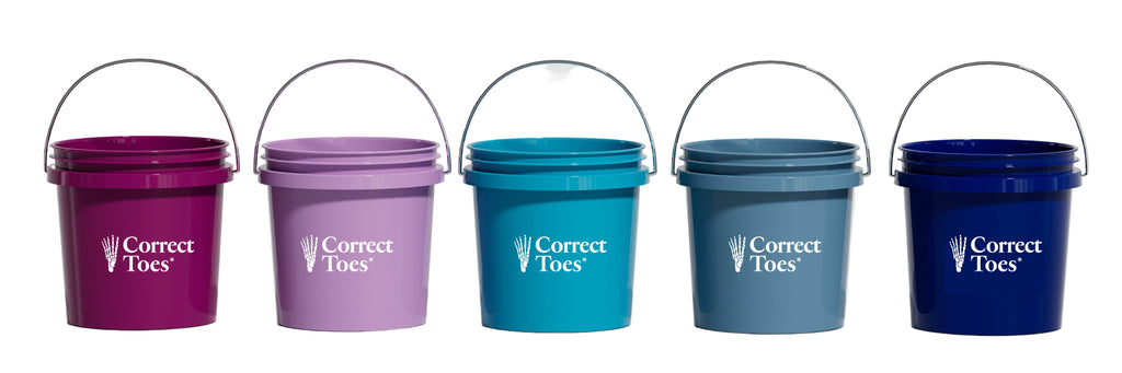 Five colorful small buckets in plum, mauve, aqua, mist, and galaxy with metal handles and Correct Toes logos.