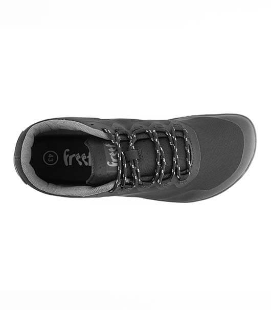 Black athletic sneaker with textured upper, patterned laces, and cushioned collar viewed from above.