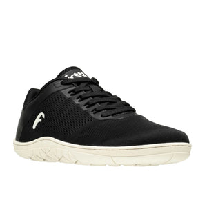 Black breathable mesh sneaker with white textured sole and logo on side and tongue.