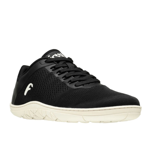 Black breathable mesh sneaker with white textured sole and logo on side and tongue.