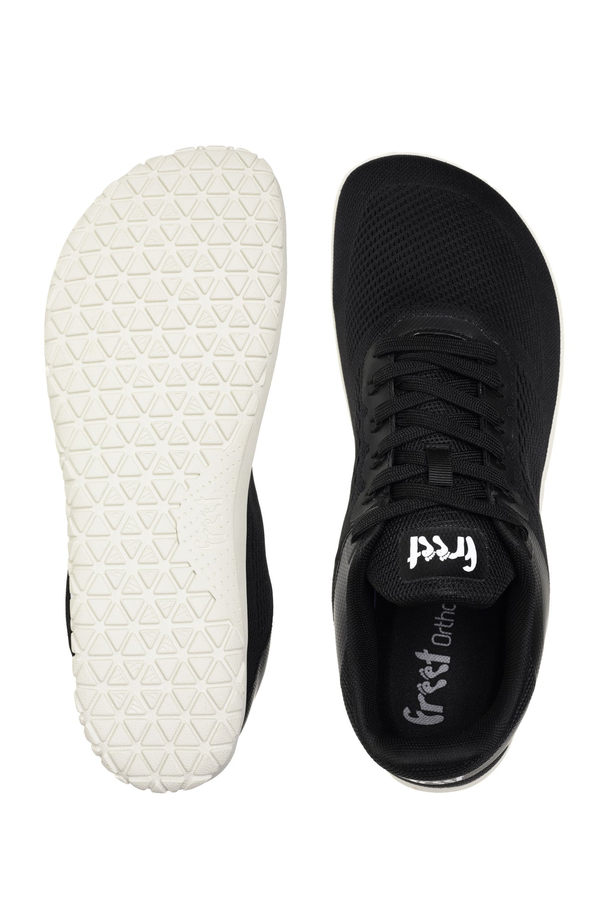Black lace-up sneaker with white textured sole and branded Freet logo on tongue.