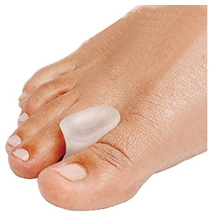 Transparent gel toe spacer positioned between the big toe and second toe on a bare foot.