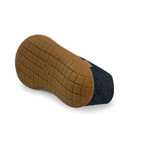 Denim felt shoe with textured honey-colored natural rubber sole shown from below.