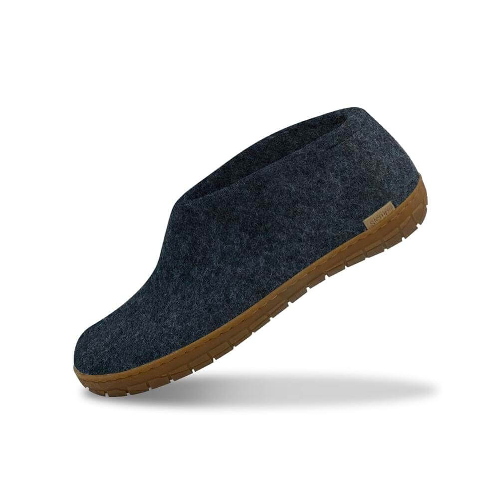 Dark denim wool shoe with honey-colored natural rubber sole and slip-on design.