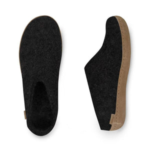 Charcoal felt slip-on with tan leather sole and rounded toe design.