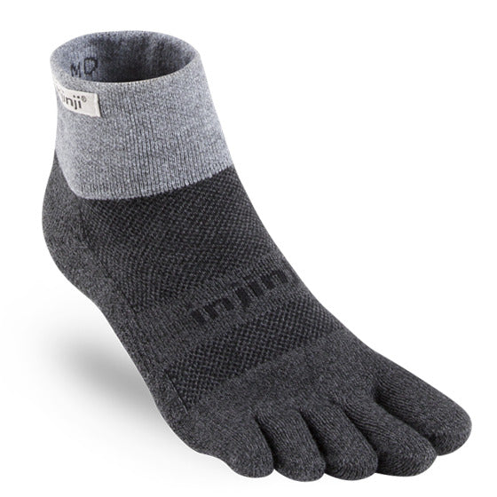 Gray and dark charcoal Injinji five-toe trail sock with cuff label and textured knit pattern.