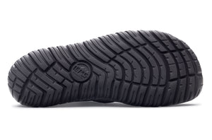Black rubber outsole with deep, multidirectional tread pattern for traction.