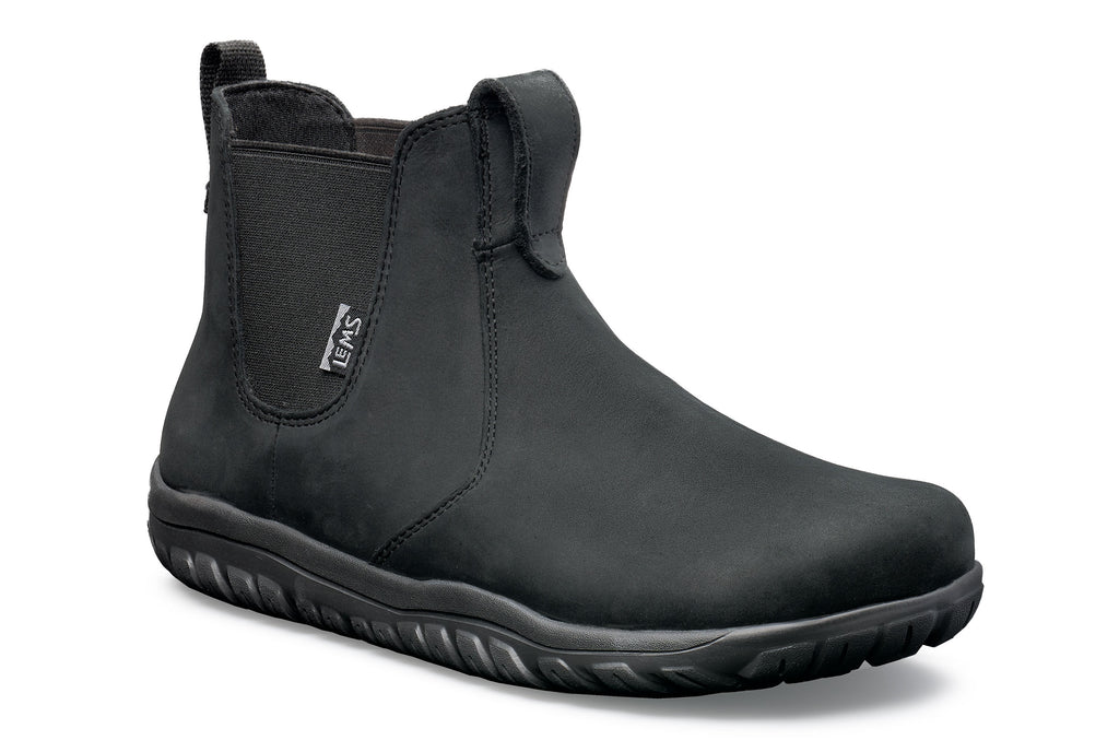 Black waterproof Chelsea boot with elastic side panels and textured rubber sole.
