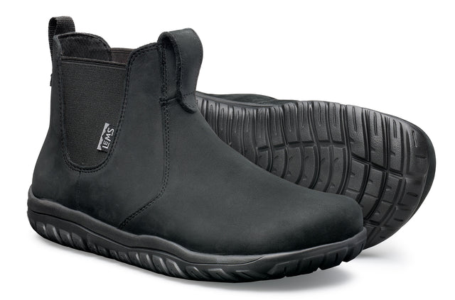 Black waterproof Chelsea boots with elastic side panels and textured rubber soles.