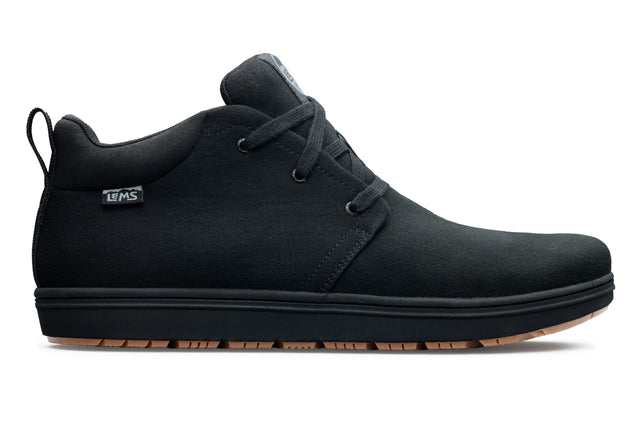Black canvas Lems Chukka Grip shoe with three-eye lacing and gum rubber outsole.