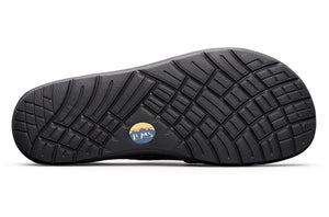 Black rubber outsole with deep tread pattern and circular Lems logo in the center.